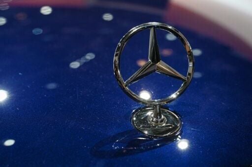 A Mercedes-Benz crest is seen on one of the German automaker's cars at the Beijing Auto Show in Beijing