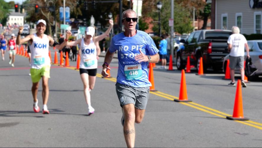 Navy veteran and NorthShore brand ambassador Steve Parker en route to a 35:53 finish in the 8K at the 2026 North Shore RunFest in Salem, Mass.