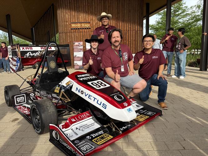 Derrick Edmonds, Electric Product Specialist at ROMCO Equipment Co. (center), with members of the Texas A&M Formula SAE Electric Team.