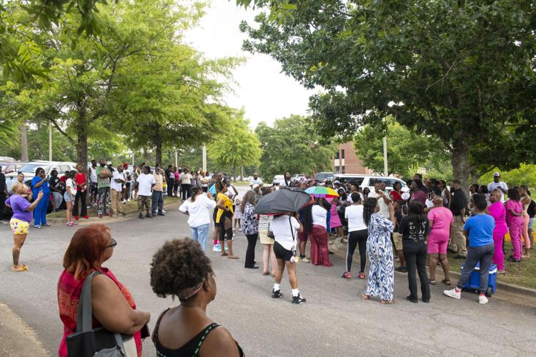 PHOTOS: Residents gather for murder victim and justice