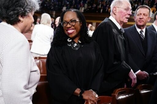 US Supreme Court Justice Ketanji Brown Jackson (C) is one of many women of color who have faced disparaging insults from President Donald Trump