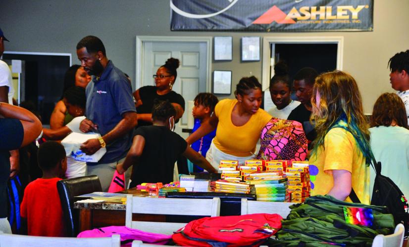 One Stop Furniture holds backpack giveaway