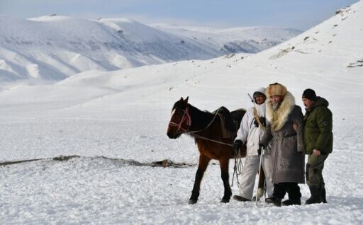 Yak breeding patriarch Tashtanbek, 88, is flanked by his grandson Amantur (left) and son Baatyrbek