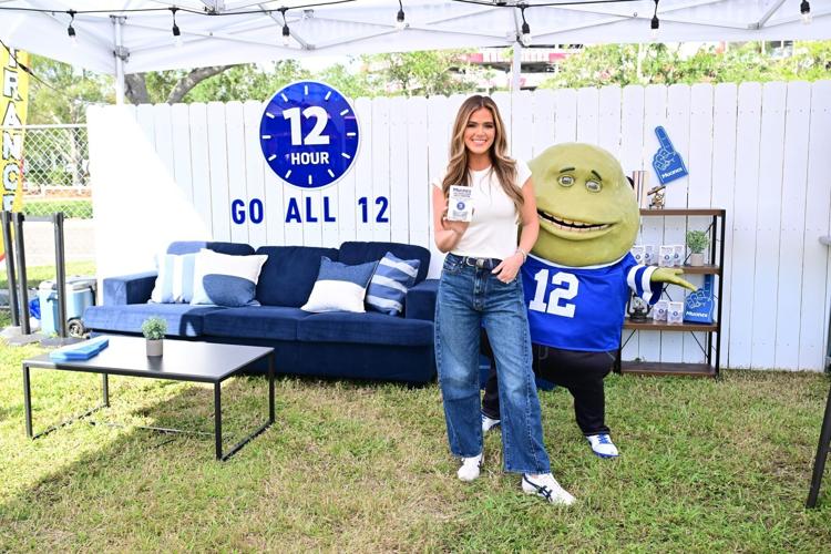 JoJo Fletcher and Mr. Mucus at Mucinex's Go All 12 Tailgate in Tampa, FL.