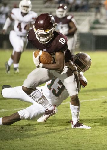 PHOTOS: Ben Russell hosts Huffman in the first game of the season