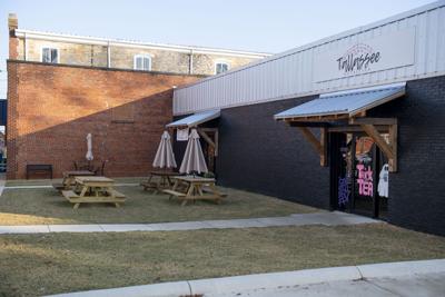 Cliff Williams / TPI The Tallassee Redevelopment Authority facade grant aided in the purchase of picnic tables and umbrellas in front of Tallassee Nutrition and Meme Sue Bakery. The grant is aimed at improving appearances in downtown Tallassee to attract people downtown.