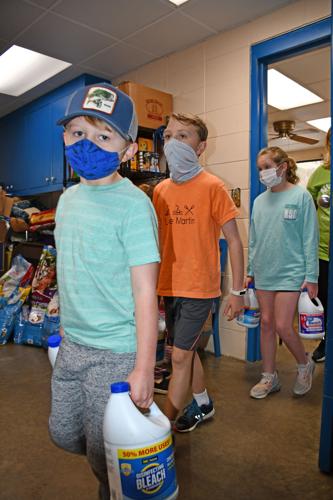 PHOTOS: students PAWS virtual learning for an hour to deliver supplies to humane society