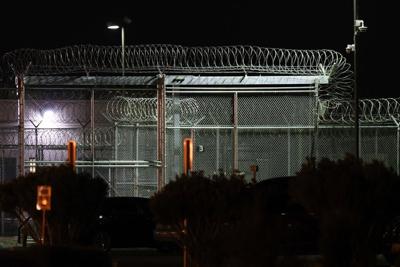 Barbed wire surrounds the GEO Group ICE detention facility in Adelanto, Calif. on July 10, 2025.