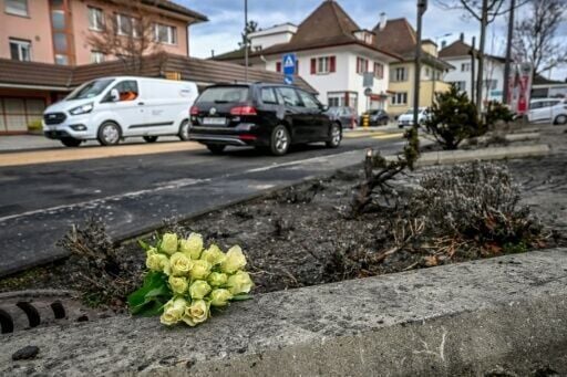 Flowers at the site where a bus caught fire in western Switzerland on March 10, 2026