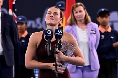 Marta Kostyuk of Ukraine speaks after defeat in the final against Aryna Sabalenka