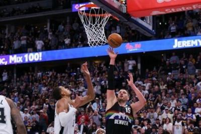 Denver's Nikola Jokic scores against Victor Wembanyama in the Nuggets' NBA overtime win over the San Antonio Spurs