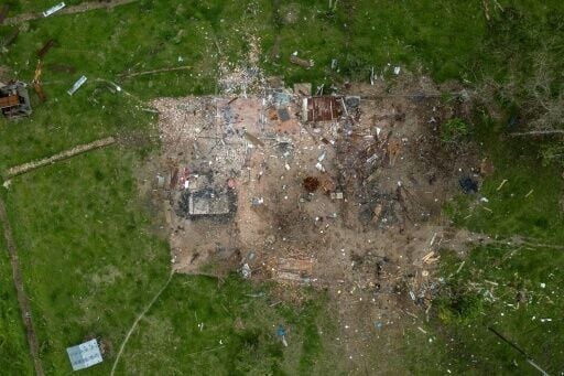 AFP visited the remote border zone where the bomb was dropped and saw three buildings reduced to rubble, their scorched zinc roofing twisted among the debris