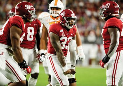 Alabama remains perfect by beating UT under the lights