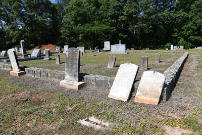 Cliff Williams / TPI Rose Hill Cemetery has been a gathering place at night for some. Despite signs noting no entry after dark, some visitors have left trash behind including beer bottles and condoms. City of Tallassee employees have been trying to keep the area clean.