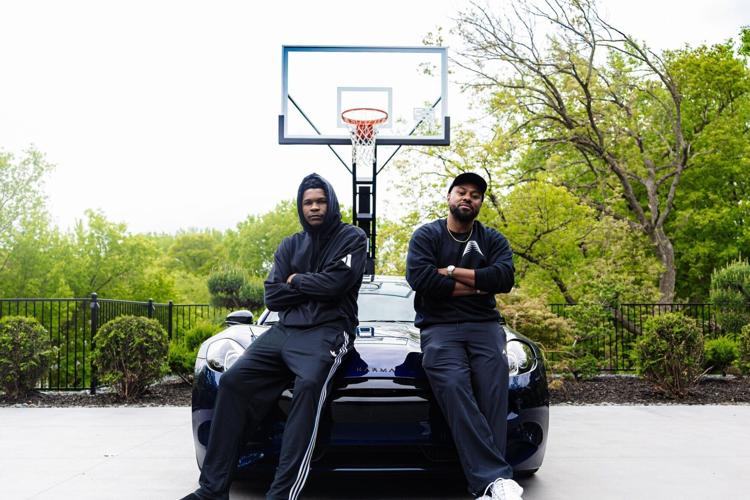 Karma Nexus members Anthony Edwards (Left) of the Minnesota Timberwolves and business manager Justin Holland (Right) with the Karma Revero sport sedan. Photo Credit: Three Fifths Media