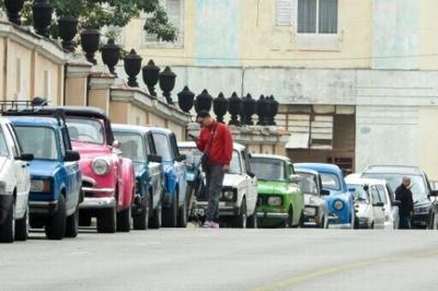 Vehicles wait in line to refuel at a gas station in Havana, with Cuba's communist government accusing US President Donald Trump of trying to 'asphyxiate' the island's economy