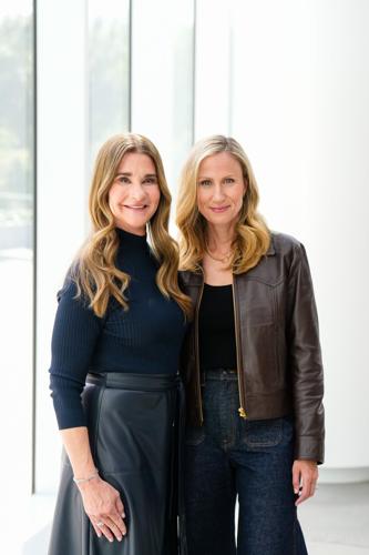 One Roof Sports and Entertainment's majority owner and managing partner, Samantha Holloway and Melinda French Gates pose for a photo.