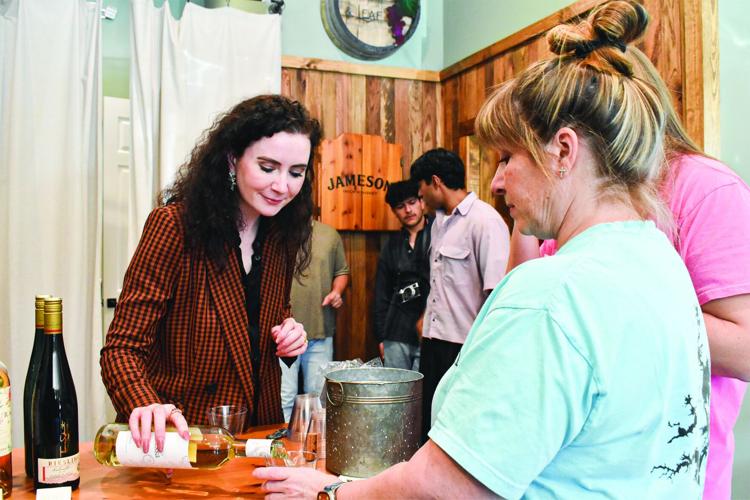 Locals try various wines at Grain & Leaf