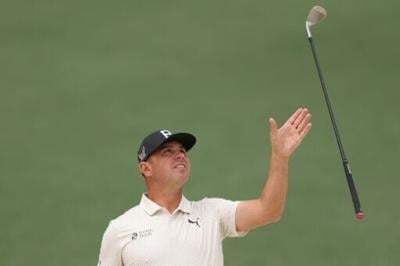 American Gary Woodland, the 2019 US Open champion, grabs his club during a practice round at Augusta National ahead of the 90th Masters
