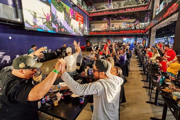 Fans erupt as the game unfolds on Atomic Golf's massive screens (Photo courtesy of Atomic Golf)