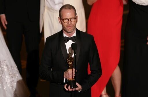 Director Joachim Trier accepts the Oscar for best international film for 'Sentimental Value'