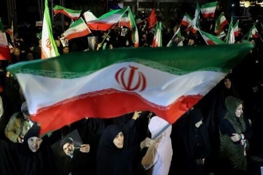 Iranians waved national flags and portraits of supreme leader Mojtaba Khamenei as they march in support of the country's armed forces in the capital Tehran