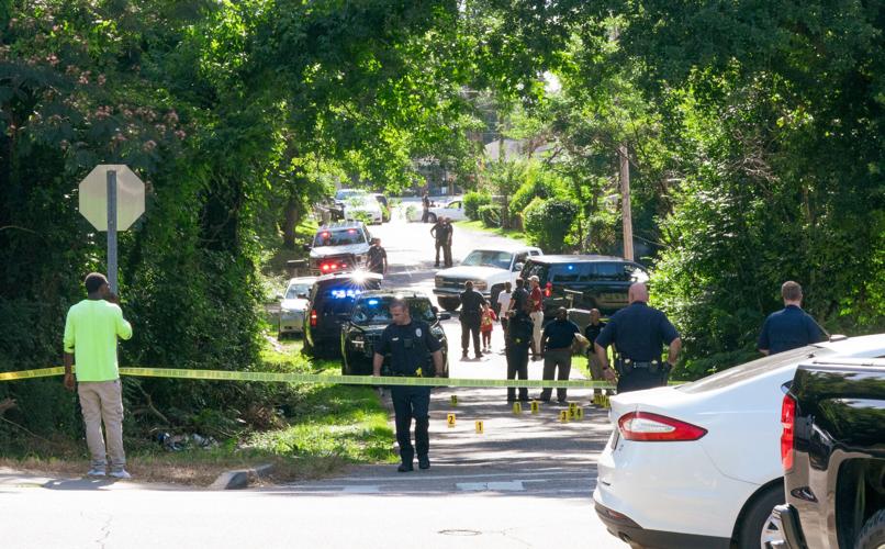 Alexander City police officers work the scene of a shooting on N street