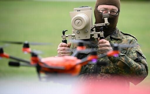German soldier holding handheld drone jammer