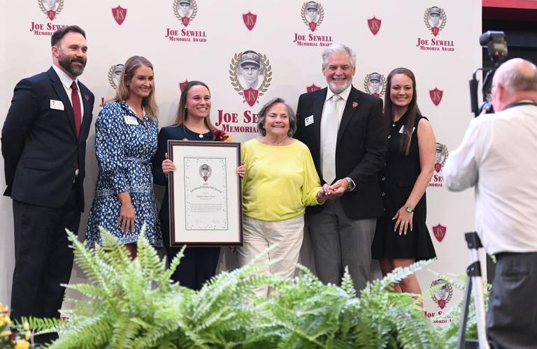 Cliff Williams / TPI Wetumpka High School senior Ashlynn Grace Turner, center, poses with members of the Joe Sewell Memorial Award board after being named the 2026 overall girls winner.