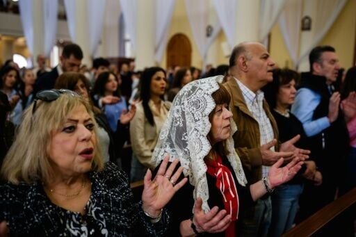 Hymns struggled to rise above the roar of Israeli fighter jets flying low over Beirut