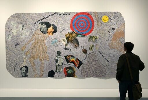 A person looks at a piece by US artist Howardena Pindell entitled 'Autobiography: Scapegoat' at the Studio Museum in Harlem in New York