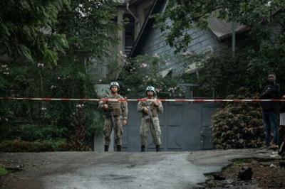 UN peacekeepers stand guard near a residence damaged by a drone strike in Goma, eastern DRC, on March 11