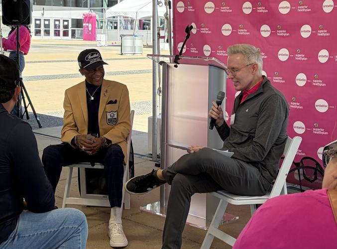 Pro Football Hall of Famer Drew Pearson engages with attendees during a fireside chat at the Ambetter Community Health Fair at AT&T Stadium in Arlington, Texas.