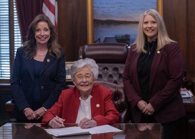 Ivey signs "What is a Woman"