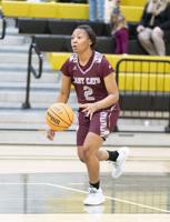 Stanhope Elmore's Burkett drops 30 enroute to victory over Lady Cats