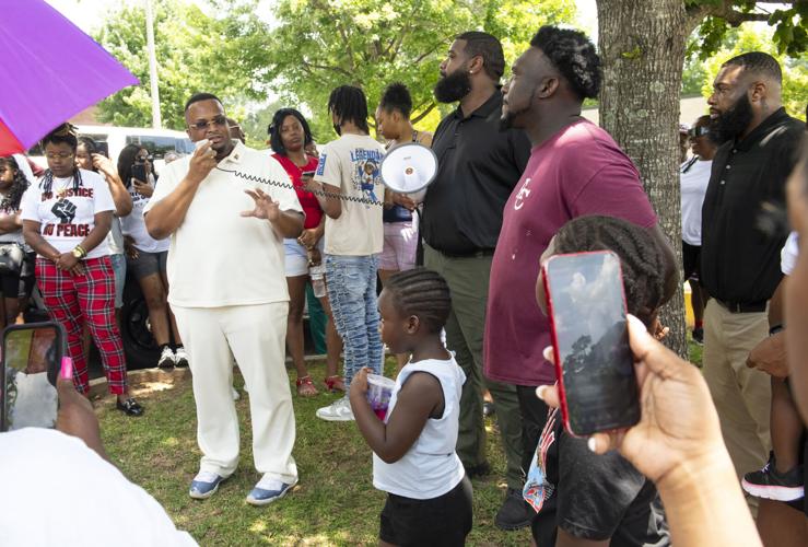 PHOTOS: Residents gather for murder victim and justice
