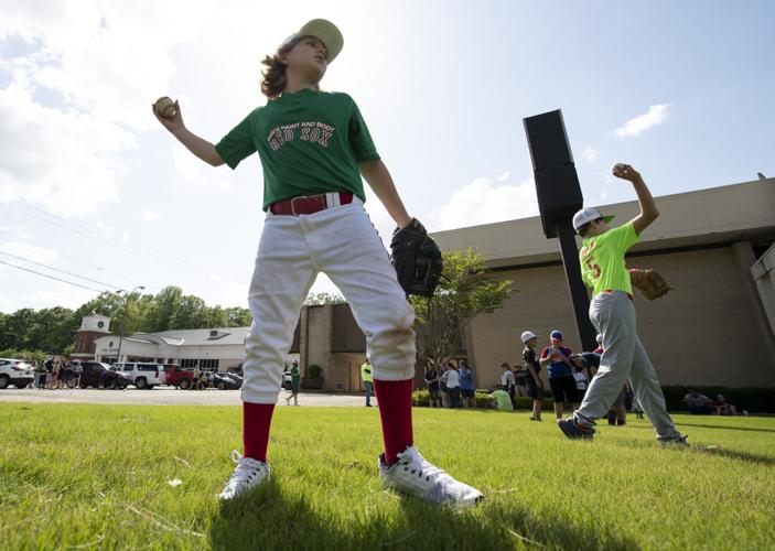 PHOTOS: Children, parents protest for kids to play ball