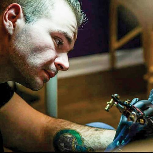 Tattoo shop owner feels his hand was forced to reopen before ready