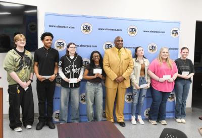 Cliff Williams / TPI Wendell Saxon, center, poses with winners of the Black History Essay contest he helps organize every year for middle and high school students. He is also greatly involved in the Black History poster contest for elementary school students.
