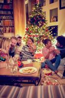 friends celebrating on Christmas Party at home.