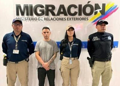 Angel Aguilar, second from left, after his arrest by Colombia immigration officials