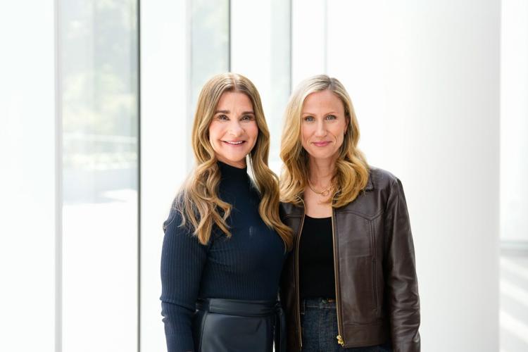 One Roof Sports and Entertainment's majority owner and managing partner, Samantha Holloway and Melinda French Gates pose for a photo.