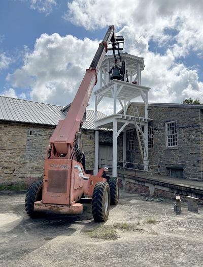 Submitted / TPI Jay and Zack Fomby work to install the bell in the 1844 mill belltower that was removed in 1957. It rang again on Sept. 11.
