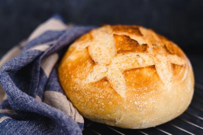 whole sourdough bread with napkin