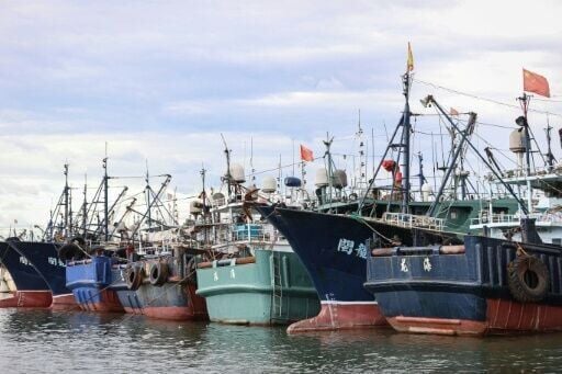 Thousands of Chinese boats mass at sea, raising questions