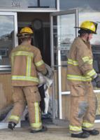 PHOTOS: No major injuries as car drives through building