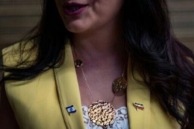 Sahar Saidian wore two pins on her lapel -- an Israeli flag and an Iranian flag from before the 1979 Islamic Revolution