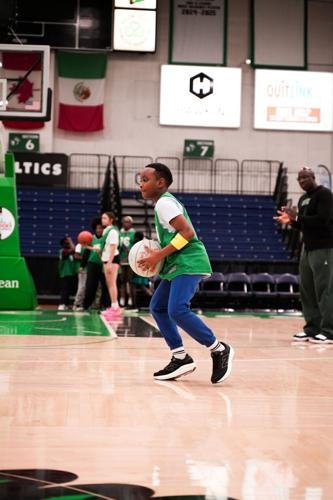 Middle schoolers from Boys and Girls Clubs of Southern Maine gather in the Celtics locker room at the Portland Expo to experience a "Day in the Life of a Player" as part of Sun Life's