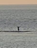 Boy dressed as Batman helps save man from rising tide after spotting frantic waving