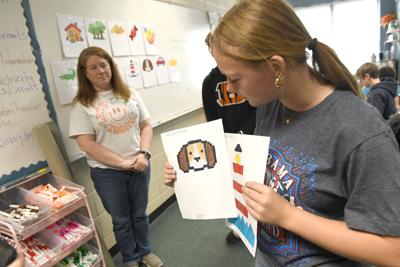 Holtville Middle School student Chloe Shackleford explains how morse code can be used to create and color drawings. She created a key to make it possible.